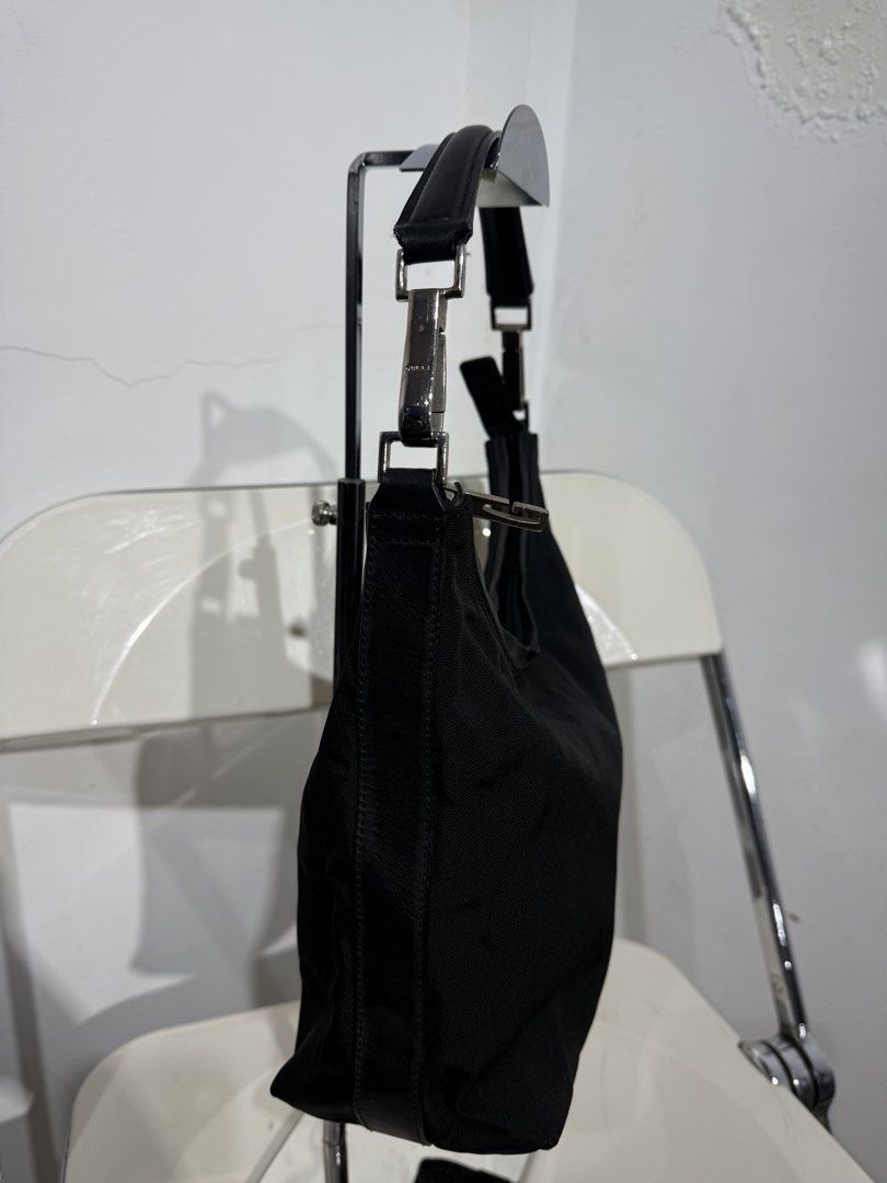 Gucci Black Nylon Leather Trim Shoulder Bag (Category: Luxury Bags & Wallets) located in Manila. Submitted by _lokithrift_ (Listing ID 1456719302, Image 3). Description: - Authentic Gucci shoulder bag - Color: Black nylon with leather trim - Hardware: Silver details - Interior: Leather tag with "Gucci made in Italy" and serial number - Closure: Zipper - Ideal for: Everyday use.