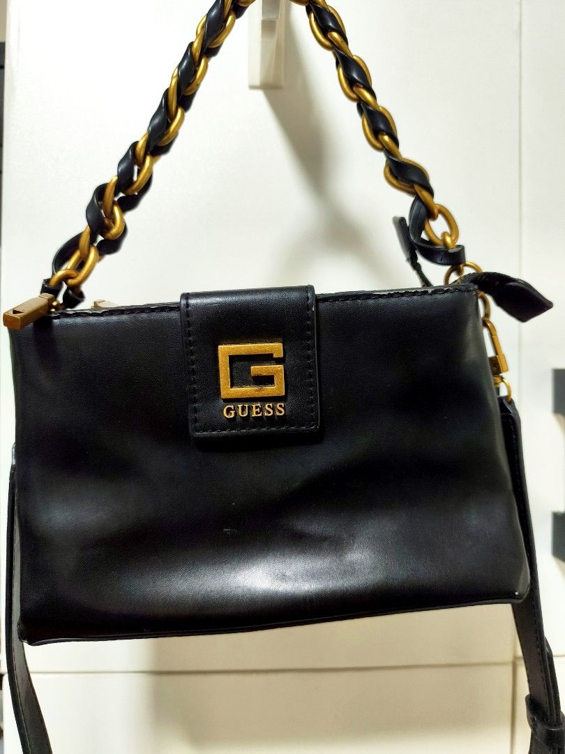 Guess Sling (Category: Shoulder Bags) located in Quezon City. Submitted by gametz (Listing ID 1456779866, Image 3). Description: Original Item ( Pre-loved item) This is a black faux leather Guess Alva Double Zip Crossbody bag featuring a distinctive braided chain handle and antique gold-tone "G" logo hardware. Guess Original - excellent condition - Clean inside and out - little signs to minmal signs of usage - very presentable still - a bit hefty