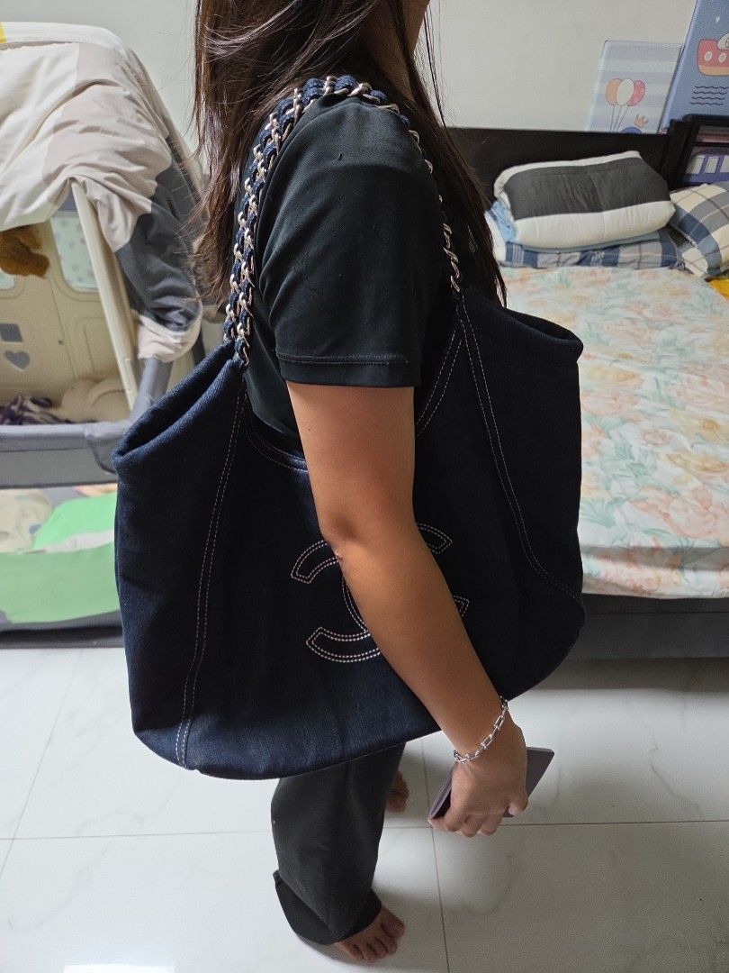 Gwp Denim Hobo Bag with Silver Chain (Category: Luxury Bags & Wallets) located in Quezon City. Submitted by jeckaloca03 (Listing ID 1454298648, Image 1). Description: gwp Chanel dark wash denim hobo bag - Iconic white stitched CC logo - Silver chain strap - Interior lining with repeating Chanel logo - Includes matching Chanel pouch - Comes with original dust bag.