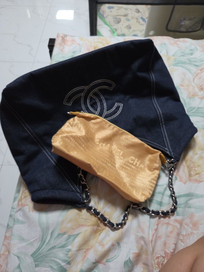 Gwp Denim Hobo Bag with Silver Chain (Category: Luxury Bags & Wallets) located in Quezon City. Submitted by jeckaloca03 (Listing ID 1454298648, Image 2). Description: gwp Chanel dark wash denim hobo bag - Iconic white stitched CC logo - Silver chain strap - Interior lining with repeating Chanel logo - Includes matching Chanel pouch - Comes with original dust bag.