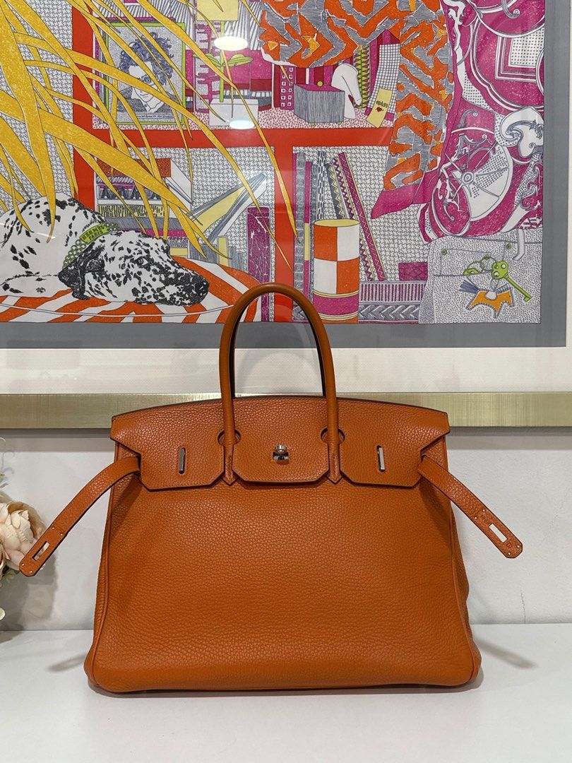 Hermes Birkin 35 (Category: Luxury Bags & Wallets) located in Taguig. Submitted by consumergoodstrading (Listing ID 1456657637, Image 3). Description: Hermès Birkin 35 Orange | Togo Leather | PHW Stamp L — Square A timeless Hermès classic in a vibrant Orange shade — elegant, iconic, and effortlessly luxurious. A beautiful piece for collectors and Hermès enthusiasts alike. Complete Set Includes: • Dust bag • Lock & Keys • Care Card • Box For More 