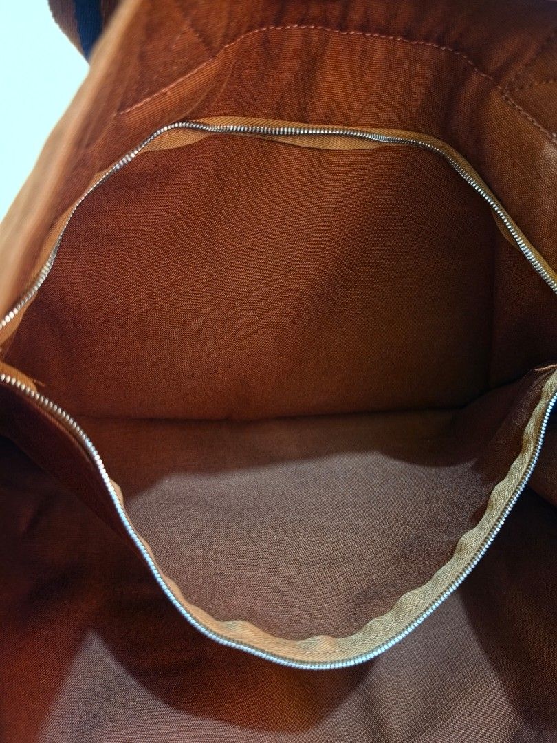 Hermes Fourre-Tout Brown Canvas GM Tote (Category: Luxury Bags & Wallets) located in Cavite. Submitted by kazi_preloved (Listing ID 1456779968, Image 3). Description: - 100% Authentic Hermes Tote bag - Brown canvas tote bag - Secure snap button closure at the top - Spacious main compartment for all your essentials - Interior zippered pocket for added organization - Elegant leather zipper pull with Hermes branding - Ideal for everyday use.
