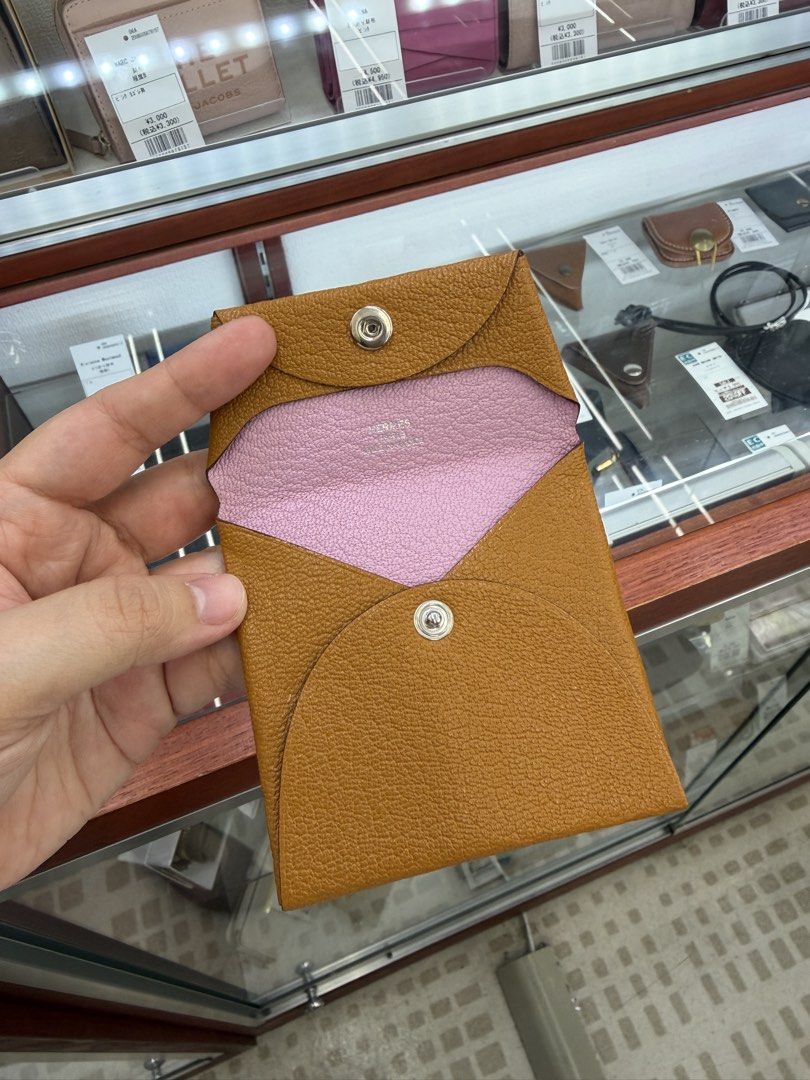 Hermes Leather Coin Pouch Brown Pink (Category: Luxury Bags & Wallets) located in Quezon City. Submitted by maria___x (Listing ID 1456769074, Image 3). Description: - Chic brown leather coin pouch - Vibrant pink interior - Secure snap button closure - Compact and pocket-friendly design - Ideal for coins and small essentials - Authentically made in France.
