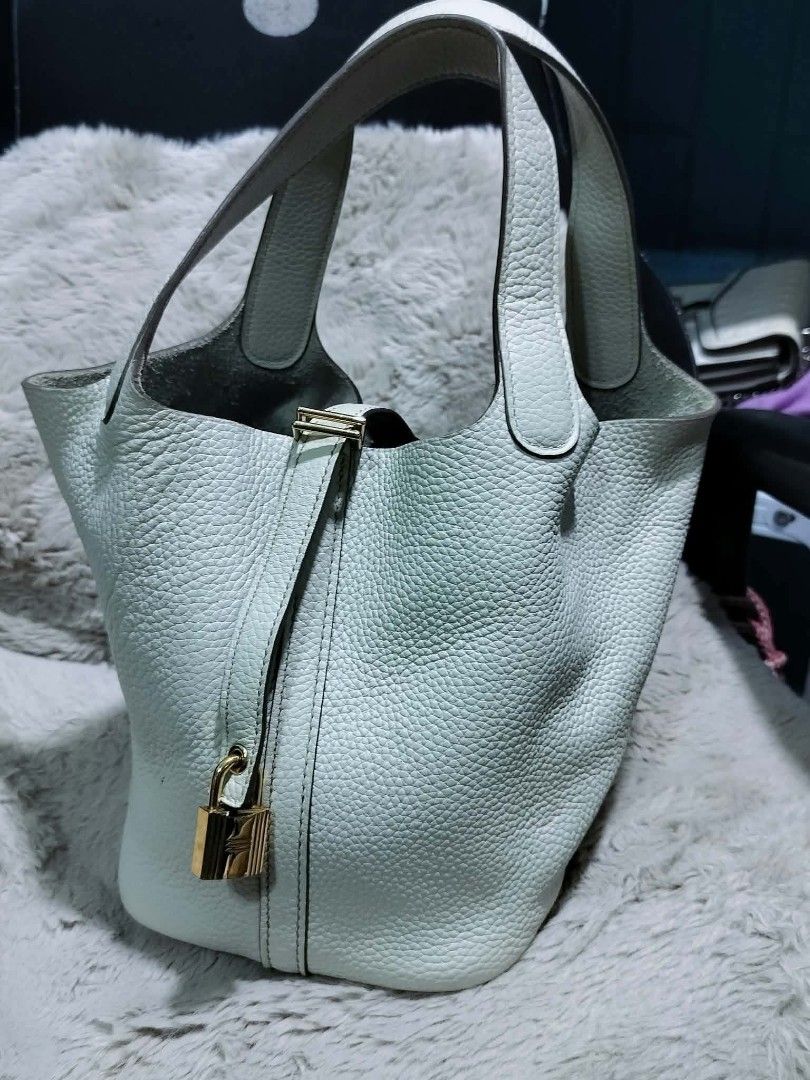 Hermes Picotin Lock Bag (Category: Luxury Bags & Wallets) located in Manila. Submitted by rose_onlineshop28 (Listing ID 1456731596, Image 1). Description: - Hermes Picotin Lock Bag - Color: Light Grey - Material: Leather - Origin: Made in France - Closure: Lock and Key - Interior Detail: Hermes Paris Stamp - Handle Condition: Good - Style: Classic and Versatile.