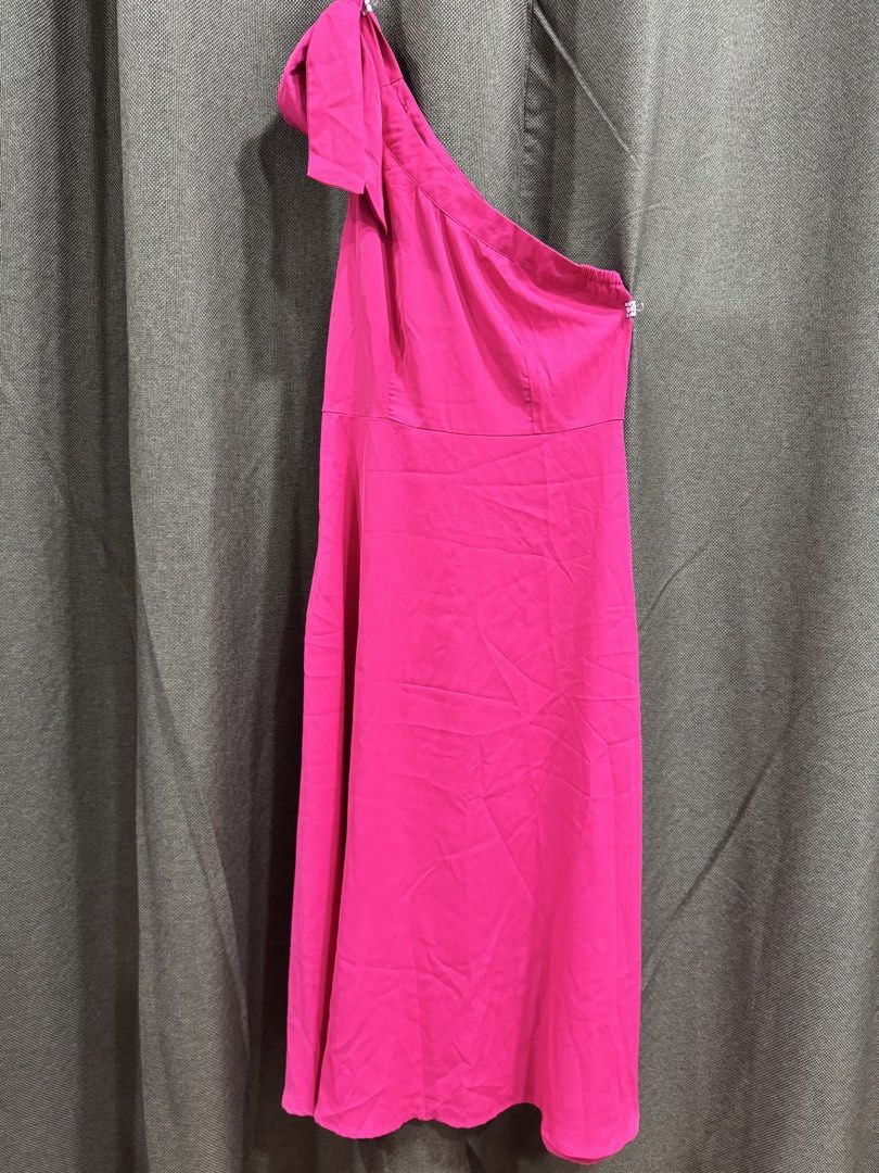 Hot Pink One Shoulder Bow Dress (Category: Dresses) located in Guiguinto. Submitted by thehiddenwardrobe (Listing ID 1456736311, Image 2). Description: - Vibrant hot pink color - Flirty one-shoulder design - Adorable bow detail on the strap - Chic midi length - Convenient side zipper closure Makapal po ang tela.