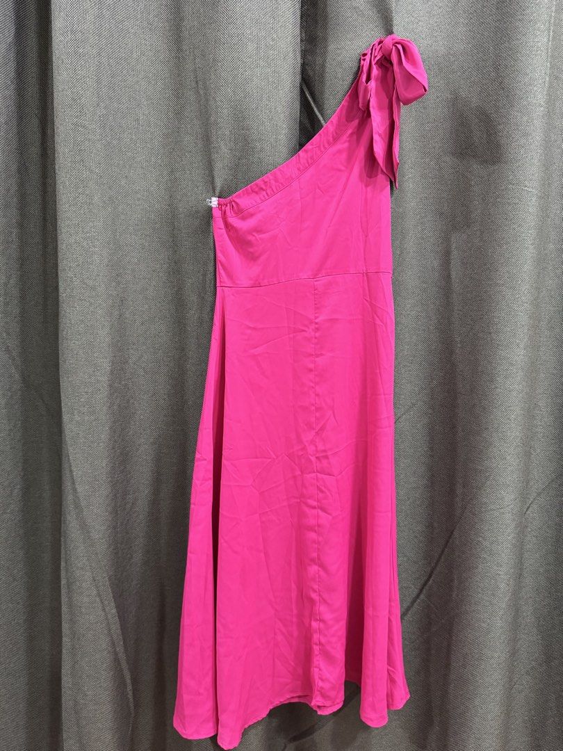 Hot Pink One Shoulder Bow Dress (Category: Dresses) located in Guiguinto. Submitted by thehiddenwardrobe (Listing ID 1456736311, Image 3). Description: - Vibrant hot pink color - Flirty one-shoulder design - Adorable bow detail on the strap - Chic midi length - Convenient side zipper closure Makapal po ang tela.