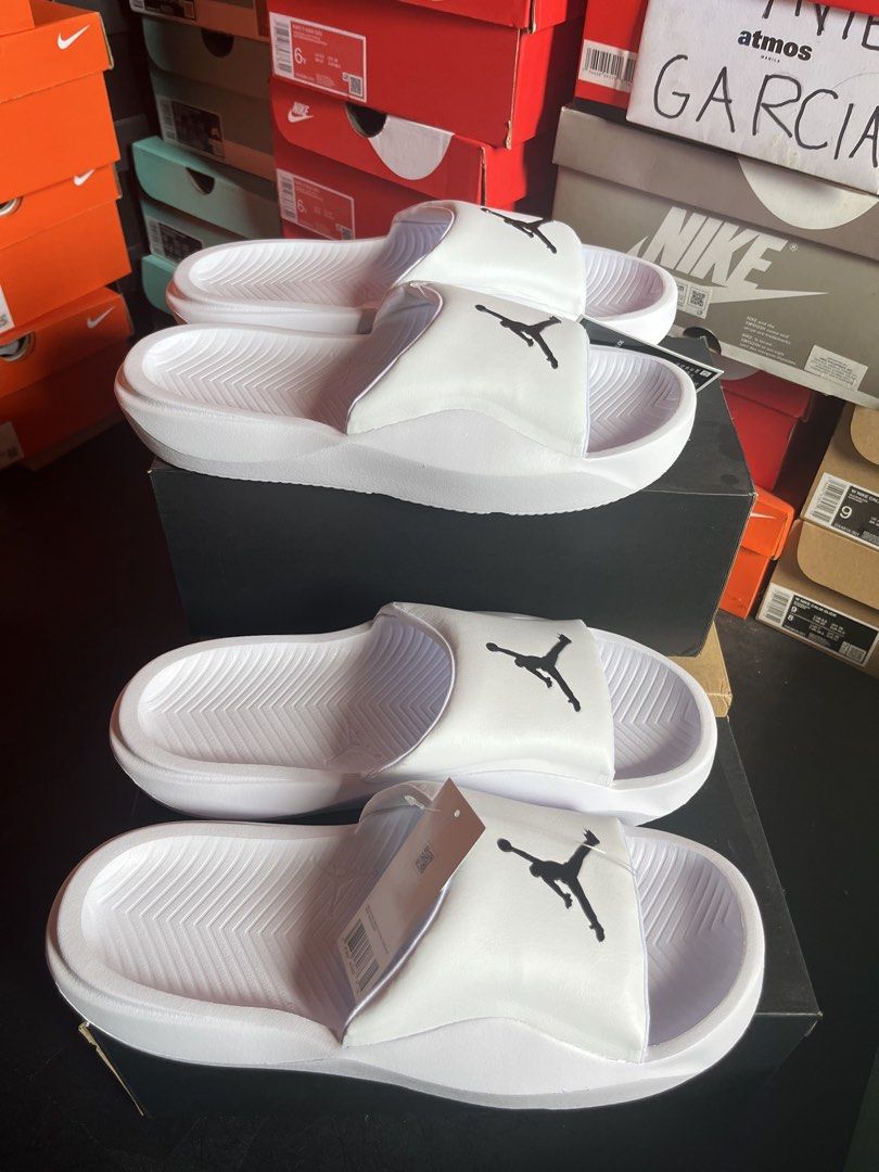 Jordan Franchise Slides White Black (Category: Slippers & Slides) located in Valenzuela. Submitted by rr.sneakerstash (Listing ID 1456738672, Image 3). Description: - White Jordan slides - Features iconic black Jumpman logo - Comfortable and easy slip-on design - Ideal for casual outings or post-sports relaxation - Comes with original tags attached - Ready for its new owner Size 10 11.
