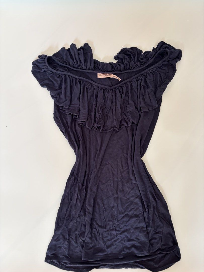 Juicy Couture Navy Blue Ruffle Off-Shoulder Top (Category: Blouses) located in Binan City. Submitted by byhiraeth (Listing ID 1456764034, Image 2). Description: - Juicy Couture navy blue off-shoulder top - Size: Medium (M) - Features cute ruffle details on neckline and sleeves - Made from soft and flowy material - Perfect for dressing up or down.