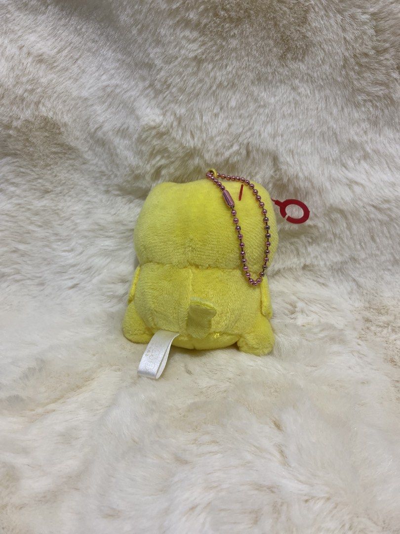 Karameru Cat plush charm keychain (Category: Plushies & Soft Toys) located in Kalibo. Submitted by ollie_stuffshop (Listing ID 1456689465, Image 2). Description: Before you send your inquiries: ❗️Last Price is already posted ❗️Manage your expectations, WYSIWYG ❗️May need washing ❗️Shipping day is every Sunday - Adorable yellow plush toy with a playful tongue sticking out. - Comes with a stylish pink beaded chain. - Includes a red loop for conveni