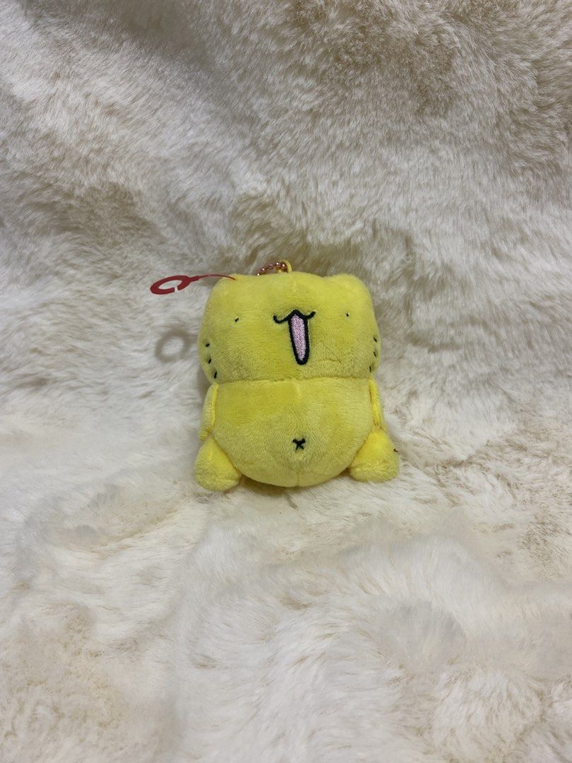 Karameru Cat plush charm keychain (Category: Plushies & Soft Toys) located in Kalibo. Submitted by ollie_stuffshop (Listing ID 1456689465, Image 1). Description: Before you send your inquiries: ❗️Last Price is already posted ❗️Manage your expectations, WYSIWYG ❗️May need washing ❗️Shipping day is every Sunday - Adorable yellow plush toy with a playful tongue sticking out. - Comes with a stylish pink beaded chain. - Includes a red loop for conveni
