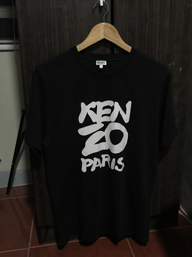 Kenzo Paris Cotton Classic Shirt (Category: Tshirts & Polo Shirts ) located in Bulacan. Submitted by dailybumps (Listing ID 1456689514, Image 2). Description: 20.5x27 Authentic No issue Embroidered "K" at the back Kenzo black T-shirt from the spring/summer collection was created using soft cotton jersey, which holds its shape well and doesn't fade after repeated washings. It's adorned with a large logo of the brand founded by Kenzo Takada (a reco