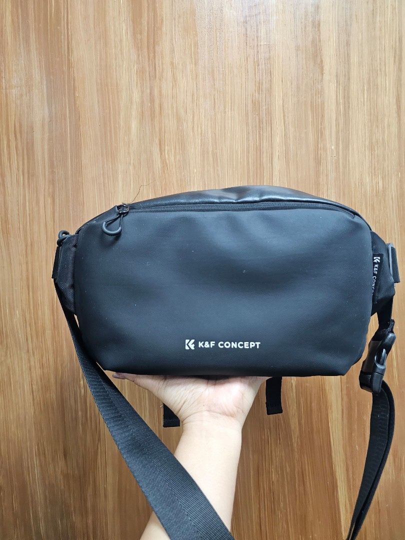 K&F Concept Black Sling Bag Camera Bag (Category: Cross-body Bags) located in Paranaque City. Submitted by rhodalietagle (Listing ID 1456626231, Image 1). Description: - K&F Concept black sling bag -Camera Bag - Durable material construction - Compact and convenient size - Main zippered compartment for secure storage - Adjustable strap for comfortable wear - Ideal for everyday use and travel - Price negotiable.