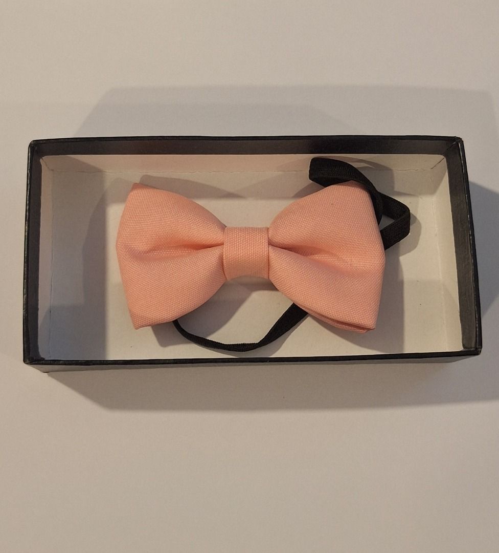 KIDS Peach Bow Tie (Category: Ties) located in General Trias. Submitted by aeunice (Listing ID 1456681993, Image 1). Description: In Good Condition. Cute peach bow tie with adjustable black strap. Comes in a small black box. Perfect for parties and special occasions. Meet up / Shipping via Lalamove, JnT, Gogo Express & LBC..