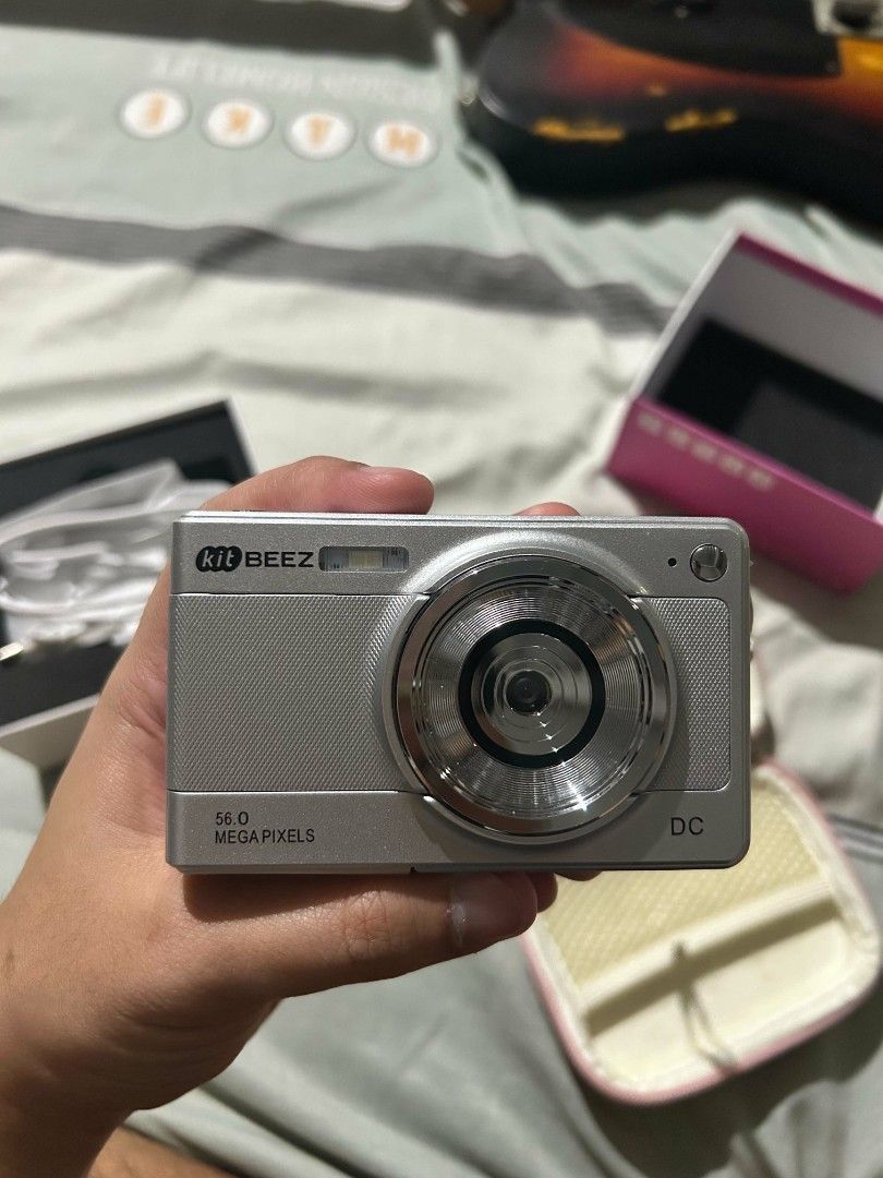 Kit Beez KC-2 Classic Digital Camera with Case and Accessories (Category: Cameras) located in Manila. Submitted by koro_mong (Listing ID 1456772407, Image 2). Description: - Kit Beez KC-2 Classic Digital Camera - Color: Silver - Megapixels: 56.0MP - Includes: Pink protective case, charging cable,sd card reader,Original box - Ideal for: Casual photography, easy to use.