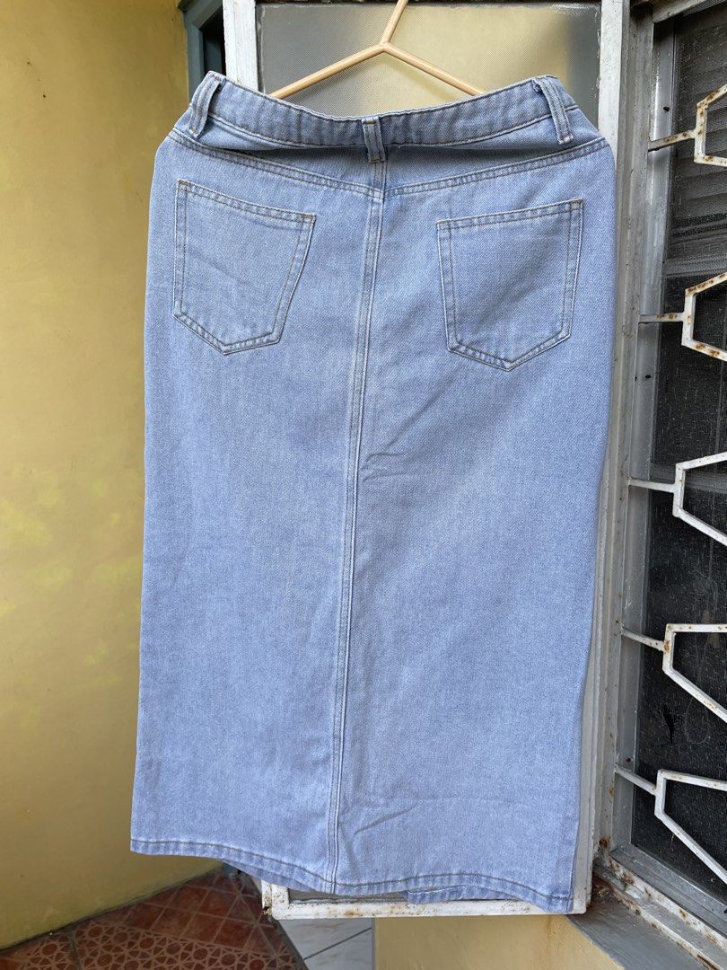 Light Wash Denim Midi Skirt with Front Slit (Category: Skirts) located in Pasig City. Submitted by khaleisi (Listing ID 1456780066, Image 2). Description: - Classic light wash denim midi skirt - Front slit for easy movement - Two back pockets - Standard belt loops - Versatile for casual or dressed-up looks - Waist 28” length 32”.