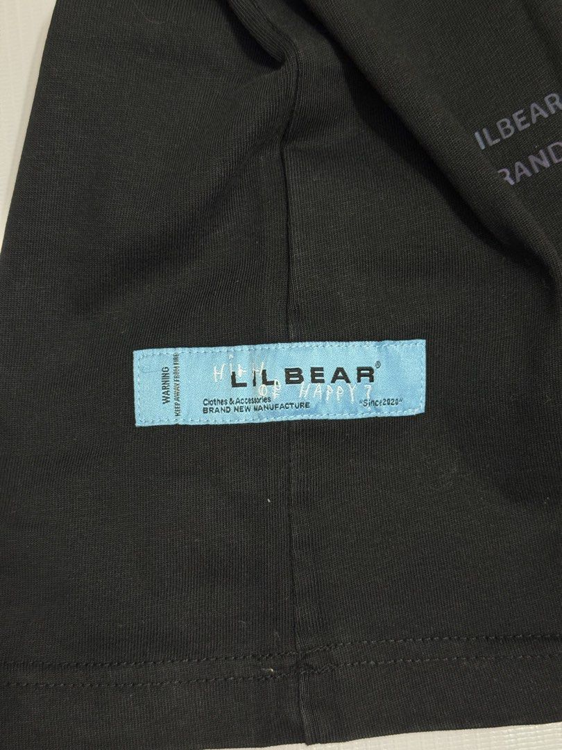 LILBEAR Black T-Shirt with Bear Graphic (Category: Tshirts & Polo Shirts ) located in Quezon City. Submitted by domsselections2 (Listing ID 1456768692, Image 3). Description: - LILBEAR t-shirt - Size: S - Small green bear graphic on the front - Large iridescent bear graphic on the back - Back also features "Since 2020" and "Clothes & Accessories" text - "BRAND NEW MANUFACTURE" tag detail Dimes: 19x26” Black na black 🙌🏻.