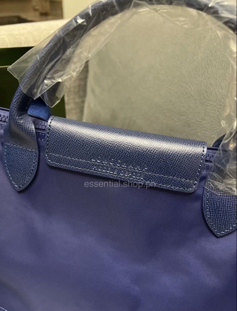 Longchamp Le Pliage Neo Medium Short Handle Navy (Category: Luxury Bags & Wallets) located in Manila. Submitted by essential.shop.ph (Listing ID 1456727296, Image 3). Description: FOR PRE-ORDER. 7-10 days ETA. Brand new and authentic Longchamp Le Pliage Neo Medium Short Handle Navy Includes paper bag, care card and original packaging..
