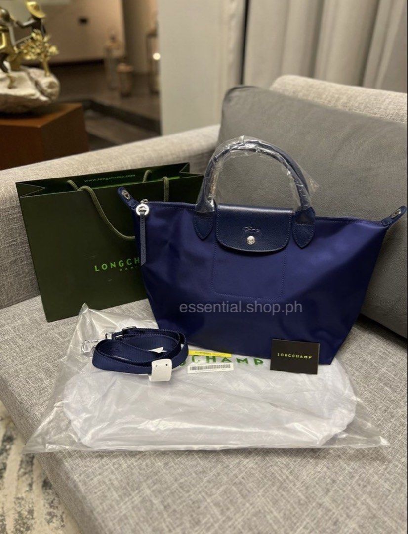 Longchamp Le Pliage Neo Medium Short Handle Navy (Category: Luxury Bags & Wallets) located in Manila. Submitted by essential.shop.ph (Listing ID 1456727296, Image 1). Description: FOR PRE-ORDER. 7-10 days ETA. Brand new and authentic Longchamp Le Pliage Neo Medium Short Handle Navy Includes paper bag, care card and original packaging..