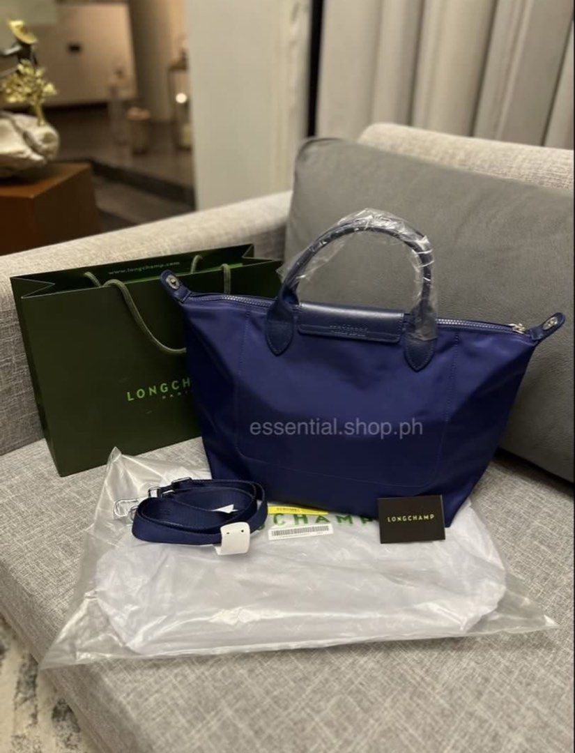Longchamp Le Pliage Neo Medium Short Handle Navy (Category: Luxury Bags & Wallets) located in Manila. Submitted by essential.shop.ph (Listing ID 1456727296, Image 2). Description: FOR PRE-ORDER. 7-10 days ETA. Brand new and authentic Longchamp Le Pliage Neo Medium Short Handle Navy Includes paper bag, care card and original packaging..