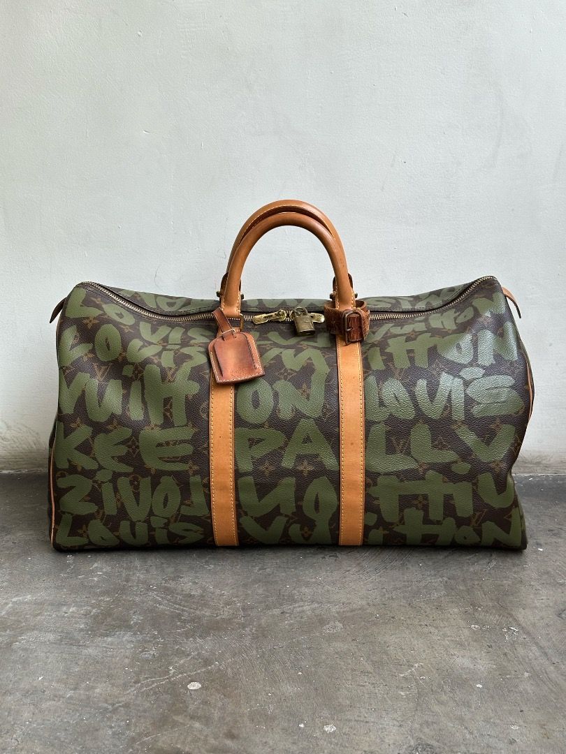 Louis Vuitton - Stephen Sprouse - Marc Jacobs - S/S 01 - Graffiti Keepall 50 (Category: Luxury Bags & Wallets) located in Manila. Submitted by graymatter_ (Listing ID 1435593508, Image 2). Description: Louis Vuitton - Stephen Sprouse - Marc Jacobs - S/S 01 - Graffiti Keepall 50 comes w/ dustbag Tagged Size: 50 Condition: Rank A Flaws: Missing Key, Spots on Vachetta Leather, Stains on Lining Material: Vachetta Leather, Coated Canvas Made in: Franc