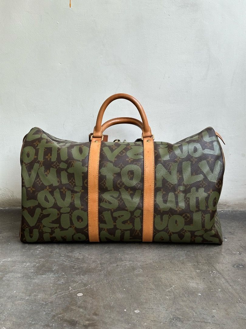 Louis Vuitton - Stephen Sprouse - Marc Jacobs - S/S 01 - Graffiti Keepall 50 (Category: Luxury Bags & Wallets) located in Manila. Submitted by graymatter_ (Listing ID 1435593508, Image 3). Description: Louis Vuitton - Stephen Sprouse - Marc Jacobs - S/S 01 - Graffiti Keepall 50 comes w/ dustbag Tagged Size: 50 Condition: Rank A Flaws: Missing Key, Spots on Vachetta Leather, Stains on Lining Material: Vachetta Leather, Coated Canvas Made in: Franc
