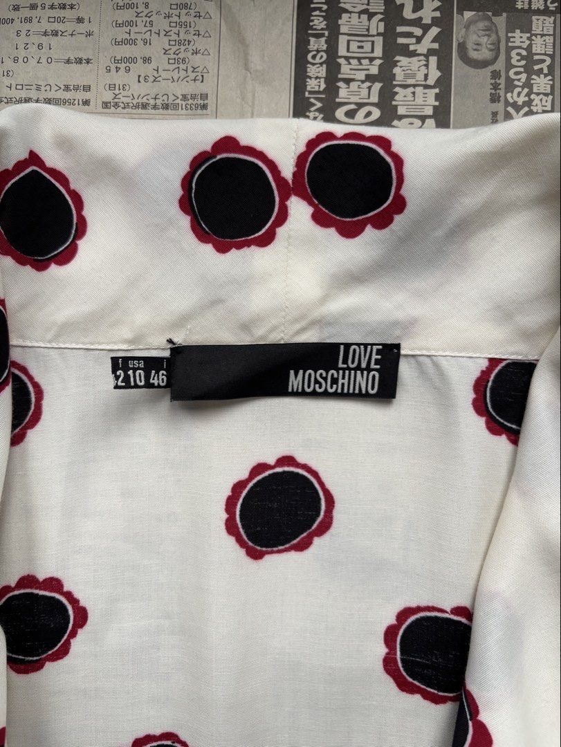 Love Moschino Viscose Shawl Top w/ Floral Pattern (Category: Sleeveless) located in Paranaque City. Submitted by grailonious (Listing ID 1456686901, Image 3). Description: Measurements posted 8.5/10 needs wash - Cream top with a fun black and red floral print. - Made from 100% viscose. - Distributed by SINV in Italy. - Ideal for a casual look..
