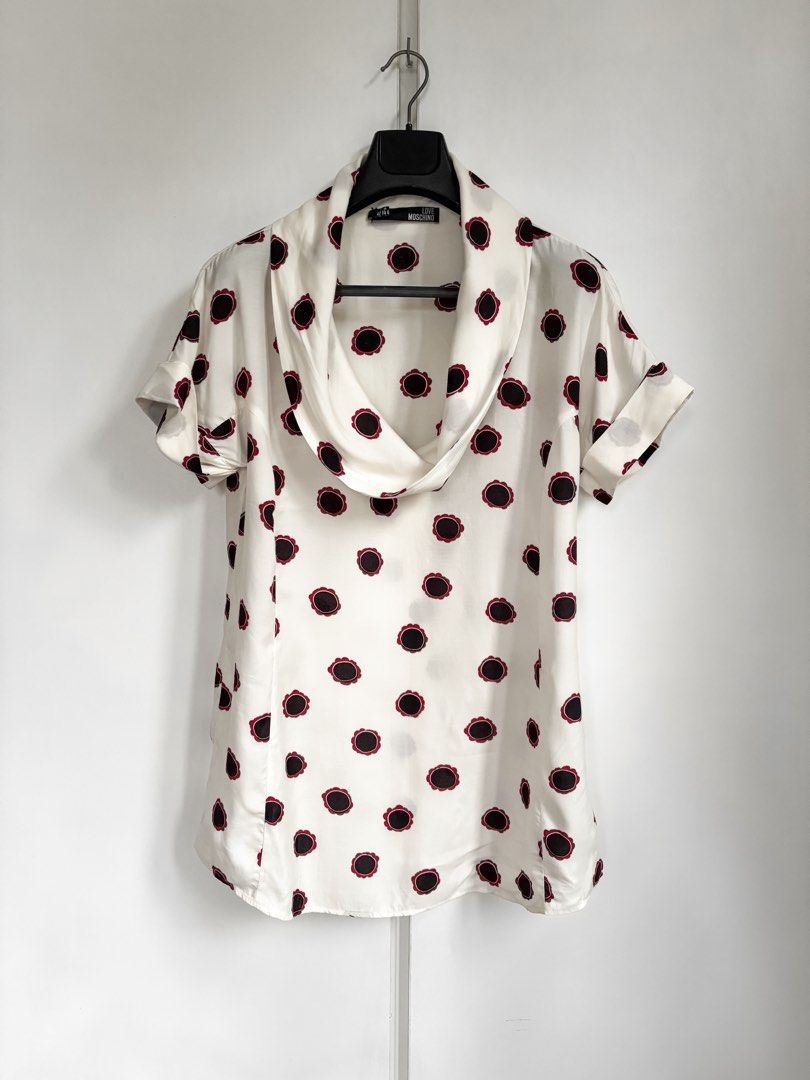 Love Moschino Viscose Shawl Top w/ Floral Pattern (Category: Sleeveless) located in Paranaque City. Submitted by grailonious (Listing ID 1456686901, Image 1). Description: Measurements posted 8.5/10 needs wash - Cream top with a fun black and red floral print. - Made from 100% viscose. - Distributed by SINV in Italy. - Ideal for a casual look..