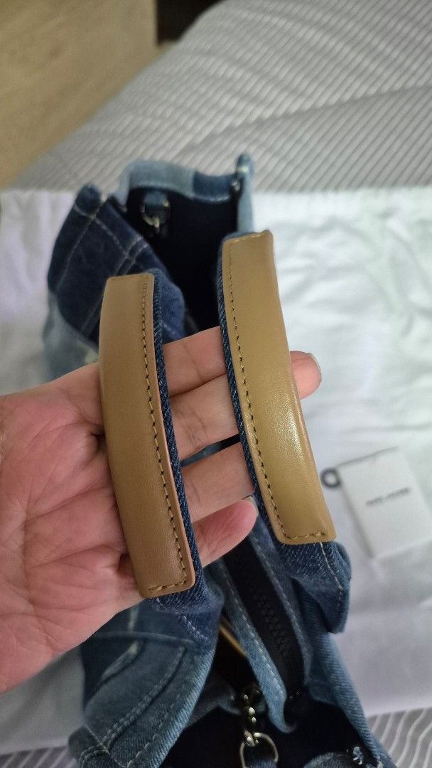 Marc Jacobs The Tote Bag Denim Patchwork (Category: Luxury Bags & Wallets) located in Paranaque City. Submitted by amymaddy (Listing ID 1456609930, Image 3). Description: - Authentic Marc Jacobs denim patchwork tote bag - Features versatile top handles and a detachable shoulder strap - Includes original dust bag and tags - Ideal for everyday style and practicality -12.5 x 10 x 6.