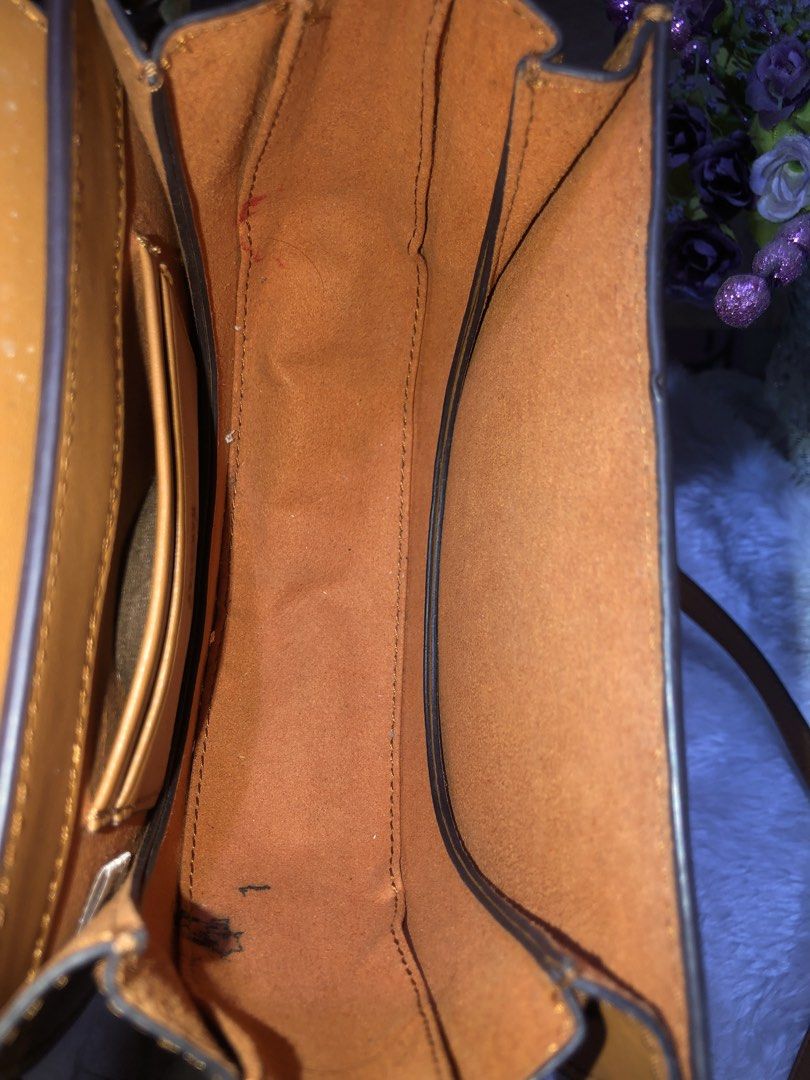 MCM Visetos Mini Backpack Cognac Gold Hardware (Category: Luxury Bags & Wallets) located in Meycauayan. Submitted by miletteaqu82717 (Listing ID 1456663622, Image 3). Description: - MCM Mini Bag - Classic cognac color with iconic Visetos print - Gold hardware details - Interior features card slots and a main compartment - Adjustable straps - Ideal for everyday use - signs of wear.