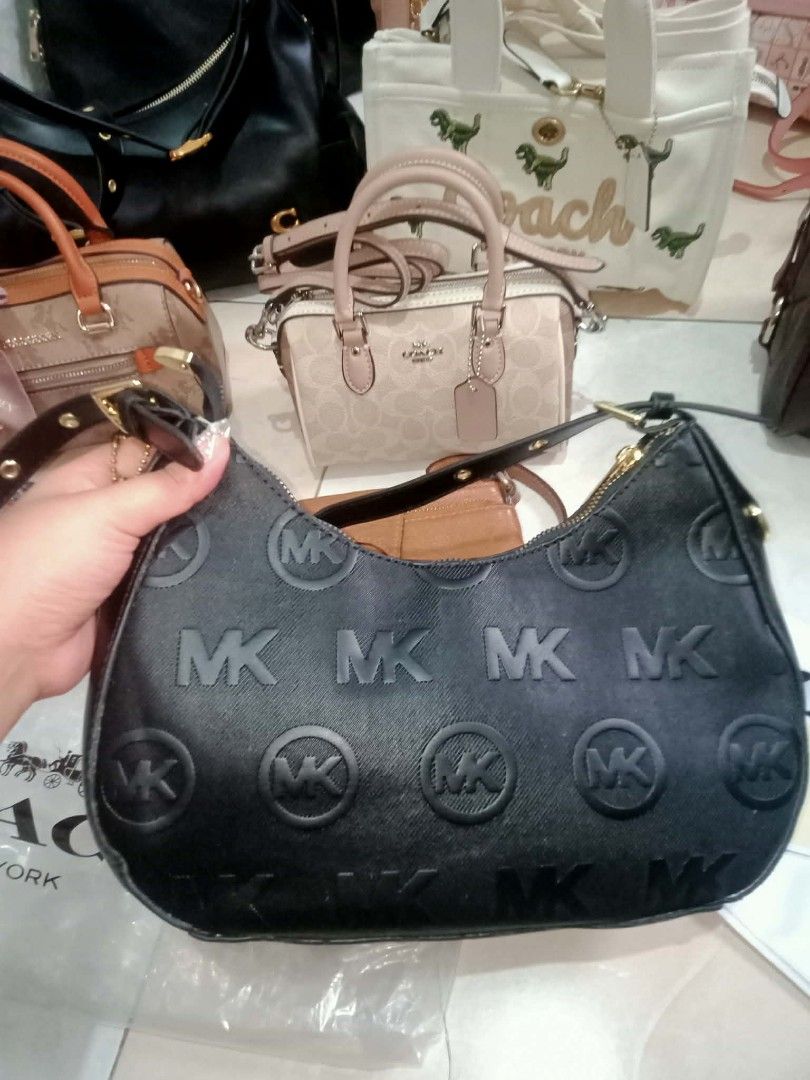 Michael Kors Black Embossed Hobo Shoulder Bag (Category: Luxury Bags & Wallets) located in Quezon City. Submitted by borresashl49573 (Listing ID 1456674288, Image 3). Description: - Authentic Michael Kors black hobo bag 😍 - All-over embossed MK logo pattern - Gold tone hardware and zipper - Interior zip pocket and slip pockets - Comes with authenticity care card ♥️ - Great everyday bag.