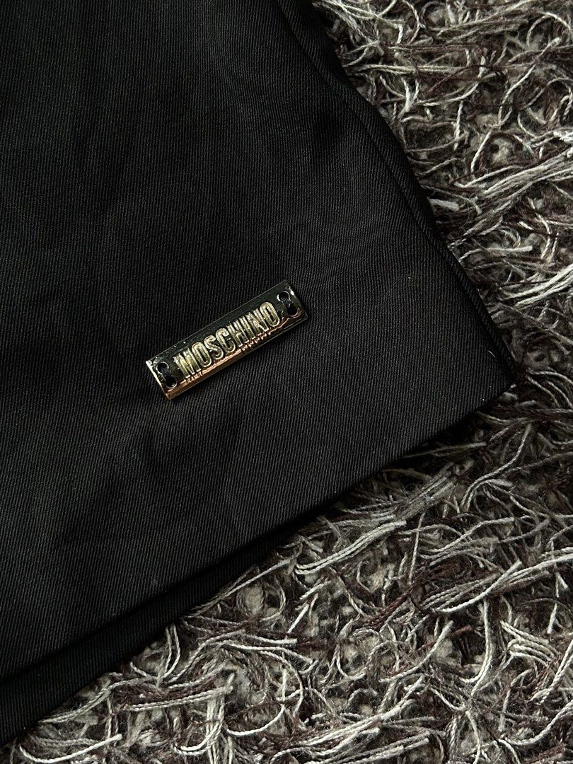 Moschino Shorts (Category: Shorts) located in Miagao. Submitted by mjhandpicked (Listing ID 1456779605, Image 3). Description: Moschino Teen Short Color: Black ***authentic; elastic waistband with bow details and metal Moschino logo plate Size: Can fit XS-SM Waistline: 26in-30in Length: 13in Inseam: 4.5in Condition+Color: 10/10 Please no rush shipping unless available😊 MOP: GCash MOD: J&T Express Location: Iloilo Province.
