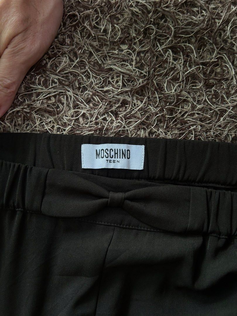 Moschino Shorts (Category: Shorts) located in Miagao. Submitted by mjhandpicked (Listing ID 1456779605, Image 2). Description: Moschino Teen Short Color: Black ***authentic; elastic waistband with bow details and metal Moschino logo plate Size: Can fit XS-SM Waistline: 26in-30in Length: 13in Inseam: 4.5in Condition+Color: 10/10 Please no rush shipping unless available😊 MOP: GCash MOD: J&T Express Location: Iloilo Province.
