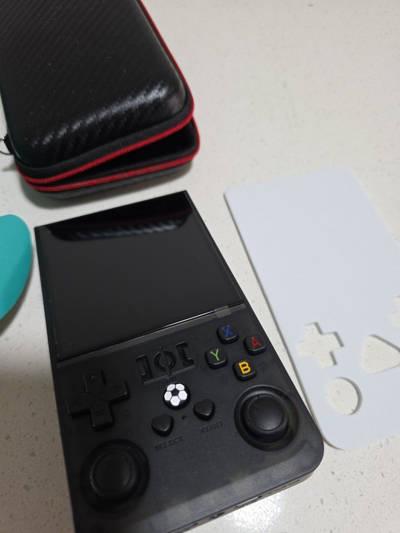 Open Source Console (Category: Remote Control Toys) located in Singapore. Submitted by brightdeer8018 (Listing ID 1456609664, Image 3). Description: - R36S Open Source Handheld Gaming Console - Comes with protective carrying case - Features dual 3D joysticks for enhanced gameplay - Perfect for reliving childhood gaming memories - comes with original box and pouch.