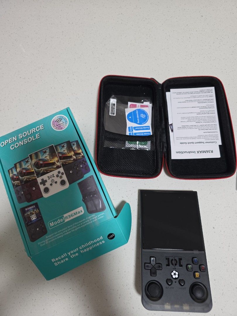 Open Source Console (Category: Remote Control Toys) located in Singapore. Submitted by brightdeer8018 (Listing ID 1456609664, Image 1). Description: - R36S Open Source Handheld Gaming Console - Comes with protective carrying case - Features dual 3D joysticks for enhanced gameplay - Perfect for reliving childhood gaming memories - comes with original box and pouch.