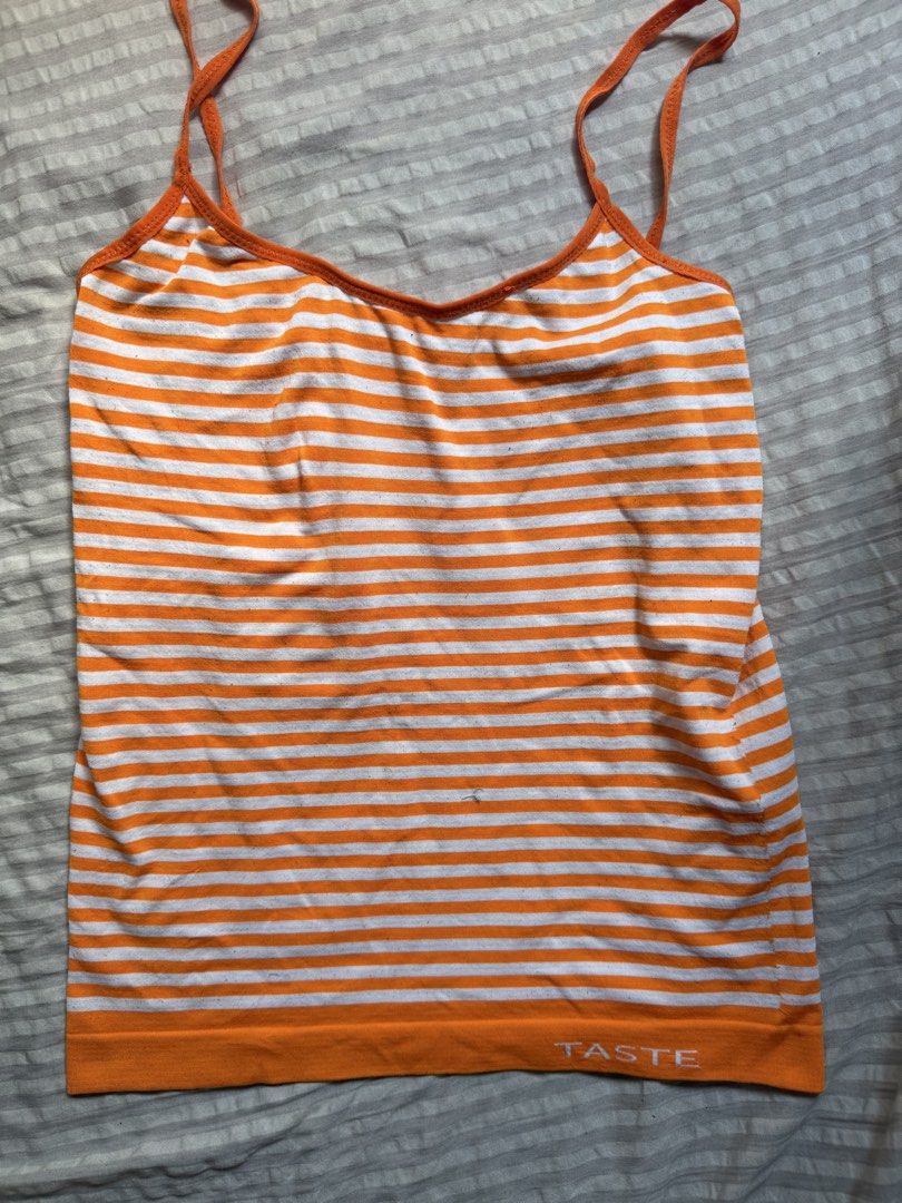Orange and White Striped Tank Top (Category: Sleeveless) located in Pasig City. Submitted by squirrelthings (Listing ID 1456622507, Image 1). Description: - small - medium - 'TASTE' logo printed on the hem - got it from ig thrift .
