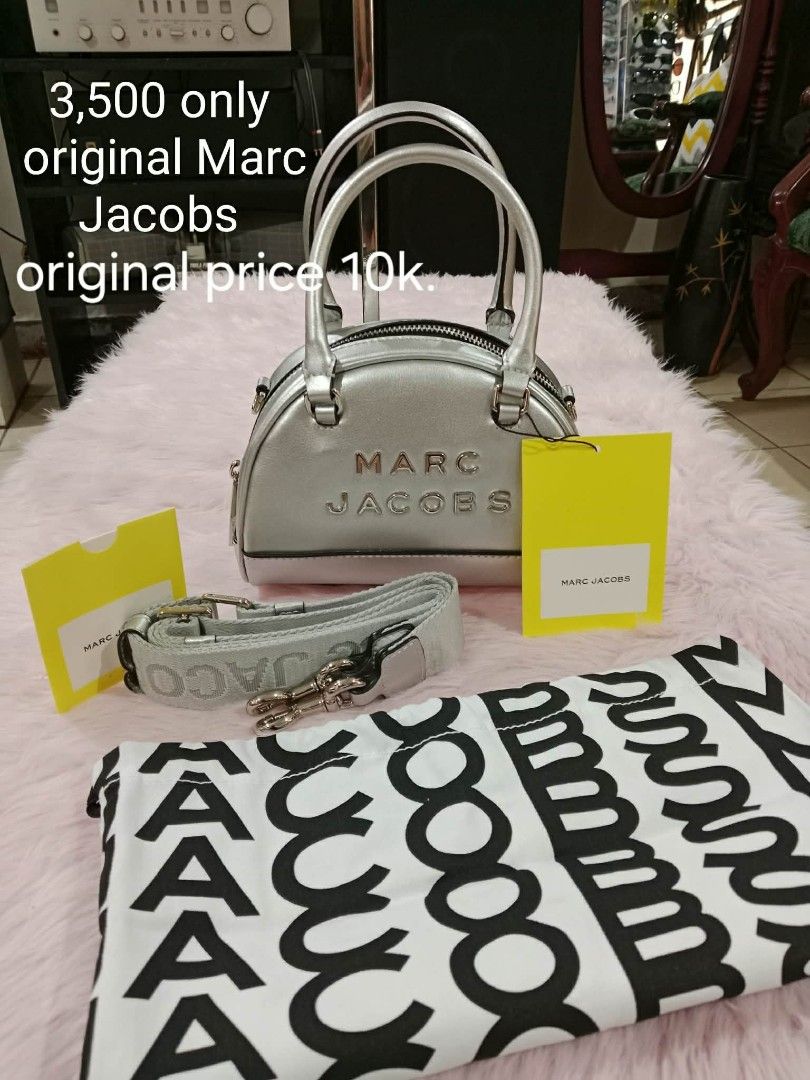 Original Marc Jacobs Silver Mini Duffle Bag (Category: Luxury Bags & Wallets) located in Pasig City. Submitted by janalopez904 (Listing ID 1456764852, Image 1). Description: - Authentic Marc Jacobs Mini Duffle Bag - Color: Silver - Original Price: PHP 10,000 - Selling Price: PHP 3,500 - Includes original dust bag and tags - Condition: Great, well-maintained - Perfect for a stylish new owner!.
