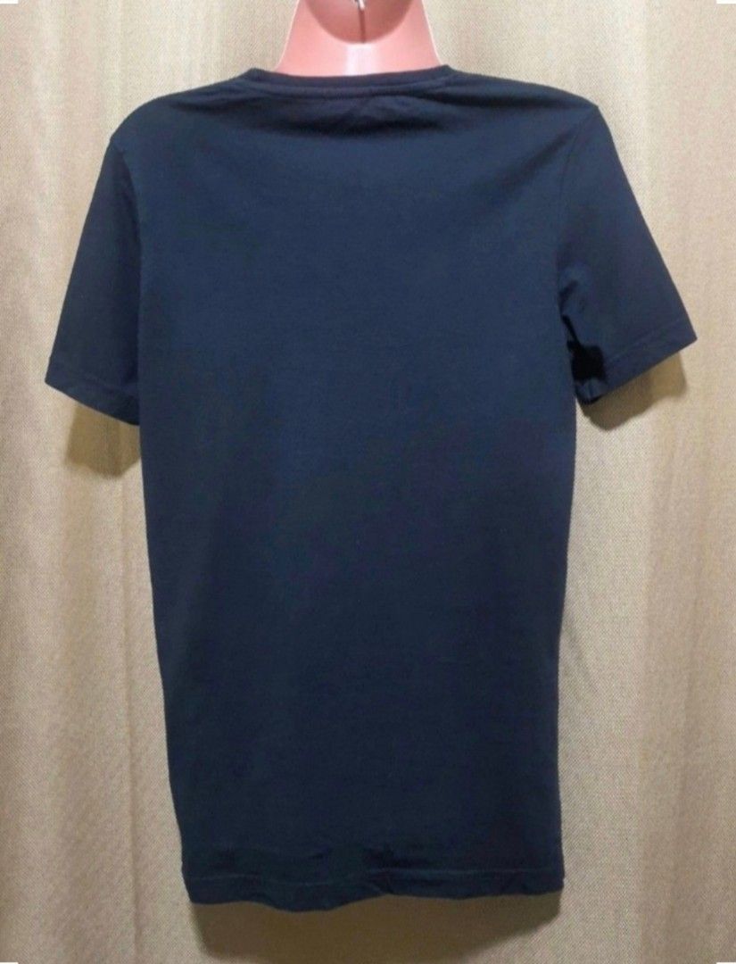 Original Valentino VLTN T-Shirt (Category: Activewear) located in Manila. Submitted by phoebecali (Listing ID 1456773771, Image 3). Description: - black Valentino t-shirt - Features iconic VLTN logo on the front - Classic crew neck and short sleeves - Simple, versatile design for casual wear - Size : small - Condition : lightly used only. No issues or whatsoever. Bought in Singapore. Taguig area 0917-240-46-48 MOP: GCASH / BDO / METROBANKB/ BPI .
