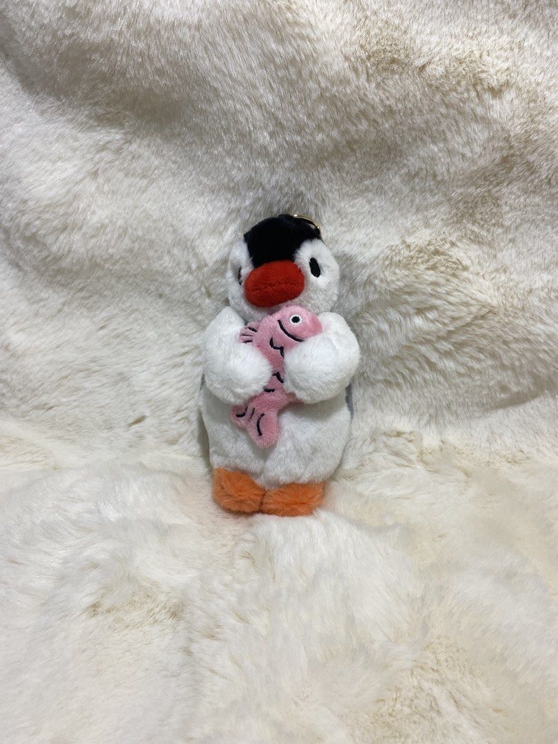 Penguin “Pingu” Plush charm Keychain with Pink Fish (Category: Plushies & Soft Toys) located in Kalibo. Submitted by ollie_stuffshop (Listing ID 1456649925, Image 1). Description: Before you send your inquiries: ❗️Last Price is already posted ❗️Manage your expectations, WYSIWYG ❗️May need washing ❗️Shipping day is every Sunday - Adorable plush penguin - Comes with a pink fish accessory - Features a keychain for easy attachment - Made from soft an