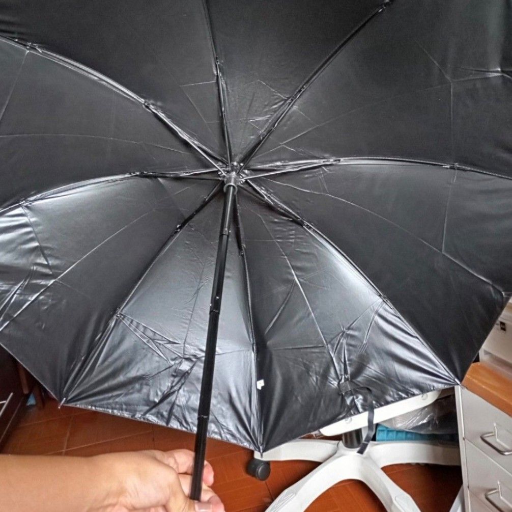 Pink Foldable Sun Umbrella UPF50+ - sold each (Category: Umbrellas) located in Quezon City. Submitted by an.marie (Listing ID 1425833624, Image 2). Description: Compact and foldable sun umbrellas. Features a pink and black design with UPF50+ protection. Includes a button closure for easy storage. Perfect for sun protection and easy to carry around. The umbrellas are in a folded state..