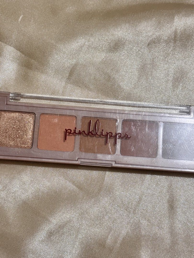 Pinklipps Eyeshadow Palette (Category: Makeup) located in Leyte. Submitted by modernpersephone (Listing ID 1456708407, Image 1). Description: - Pinklipps Eyeshadow Palette - 5 warm-toned shades - Perfect for everyday looks - Some shades feature glitter - Compact and portable design - Ideal for travel and touch-ups.