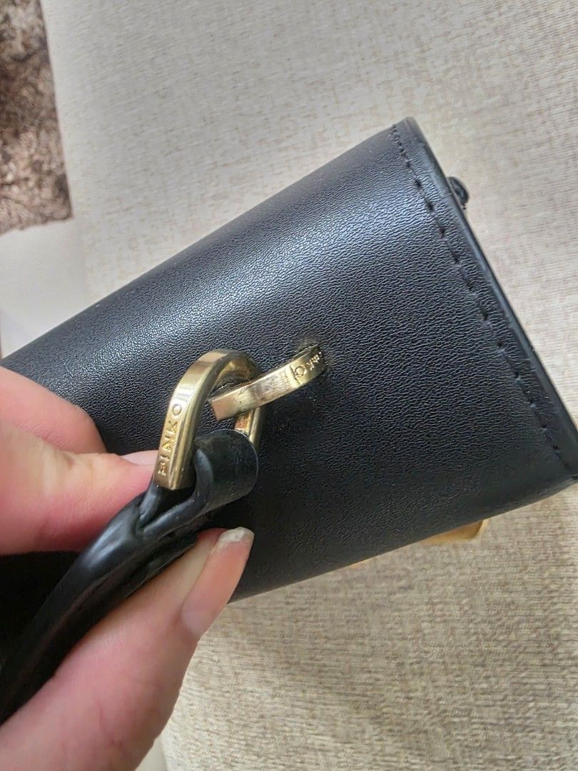 PINKO Black Leather Shoulder/Top Handle Structured Bag (Category: Luxury Bags & Wallets) located in Manila. Submitted by dcory (Listing ID 1456681366, Image 3). Description: Brand: Pinko Material: Leather Color: Black Width: 9 inches Height: 7.5 inches Interior Pockets: One flat pocket - Please expect signs of wear and a few scratches since this is a preloved item.