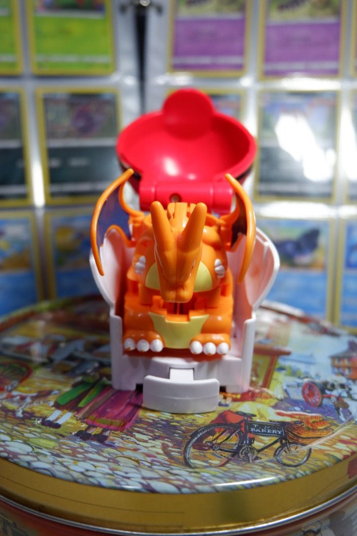 Pokemon Charizard Action Figure with Poké Ball Holder (Category: Figurines & Statues) located in Malabon City. Submitted by jayveetotz (Listing ID 1456770305, Image 1). Description: - Awesome Charizard toy that pops out of its Poké Ball holder. - Holder is red and white. - Charizard is orange with blue wings. - The head can be detached. - Perfect collectible for any Pokemon fan!.