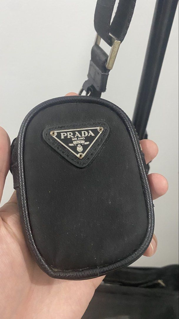 Prada Nylon Shoulder Bag with Detachable Pouch (Category: Luxury Bags & Wallets) located in Porac. Submitted by moethrifter (Listing ID 1456779217, Image 2). Description: Personal item Need to let go Please see pictures for issues Need cleaning as well Thank you so much .