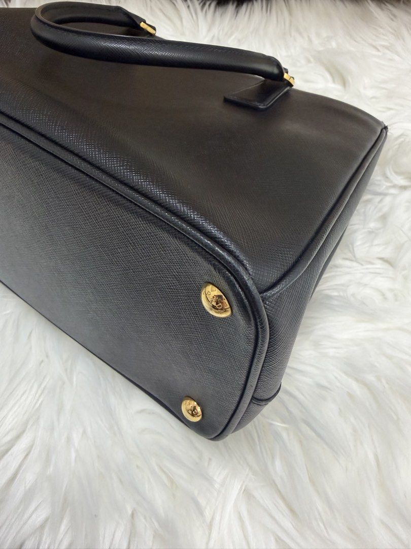 Prada Saffiano Galleria (Category: Luxury Bags & Wallets) located in Quezon City. Submitted by 9ashcervantes_ (Listing ID 1456705516, Image 3). Description: - Classic black Prada Large with ENTRUPY - Genuine Saffiano leather - Gold hardware - Top zip closure - Detachable shoulder strap included - Spacious interior - Ideal for work or everyday use - Authenticity guaranteed.