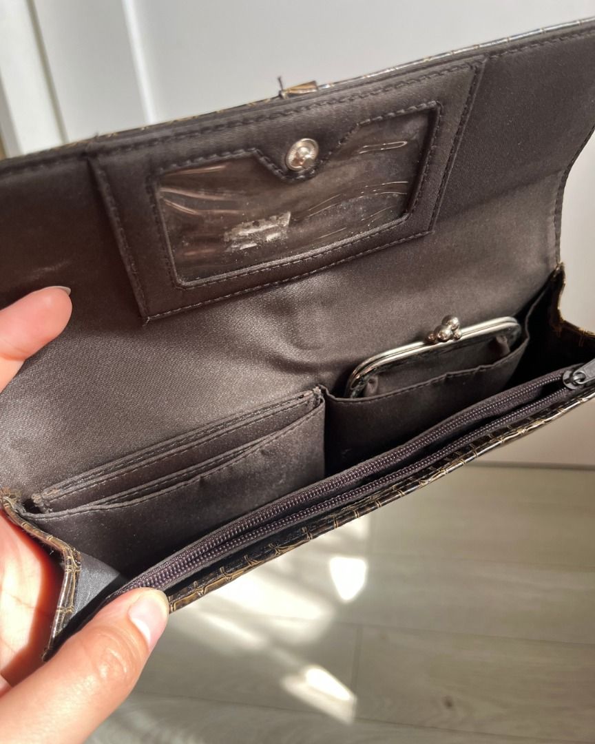 Pre-loved Brown Faux Croc Wallet (Category: Luxury Bags & Wallets) located in Taguig. Submitted by emgoofficial (Listing ID 1456647079, Image 3). Description: Stylish faux crocodile leather wallet bought in the USA. Wallet has a wristlet strap with a detachable card holder and coin purse, plus plenty of space for cash bills. 📌 Pre-loved condition with slight signs of wear and minor stitch damage inside 💬 Price negotiable! 📍 Taguig • PAYO or 3-
