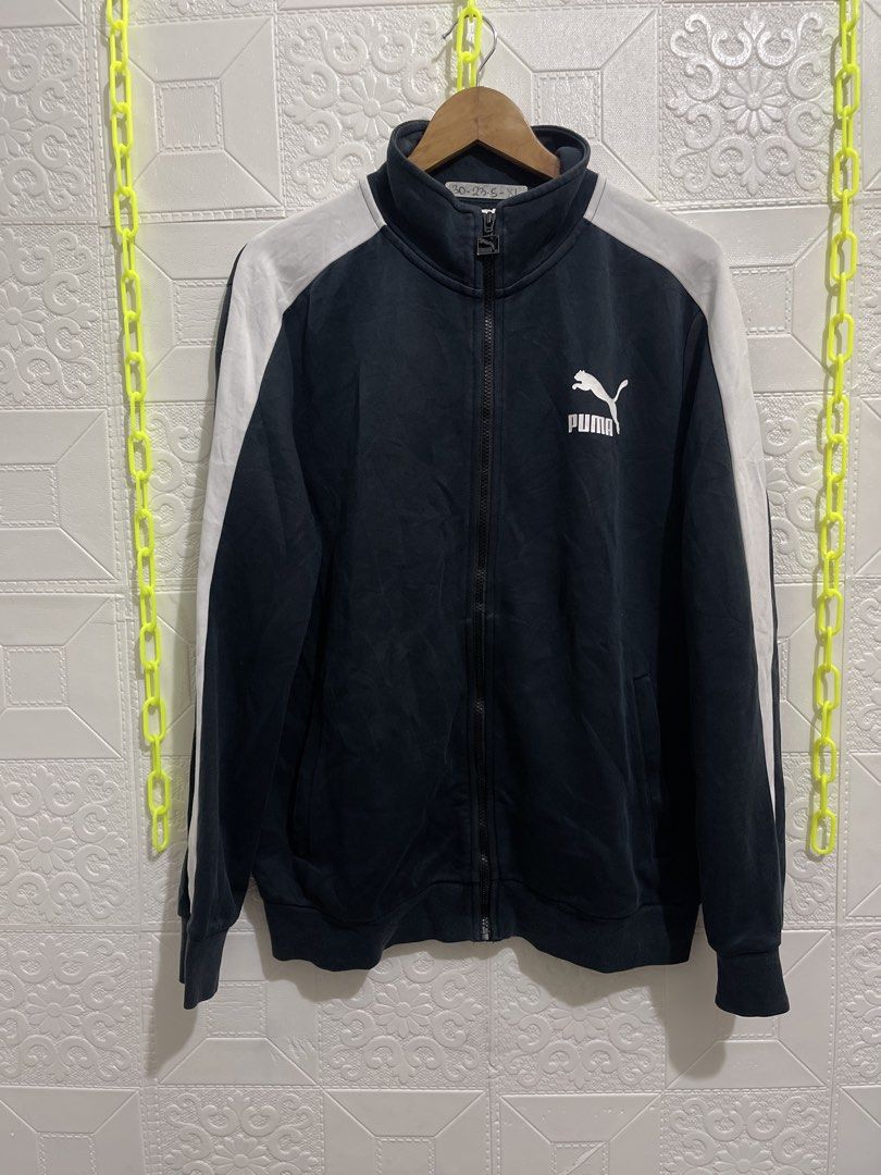 Puma Track Jacket Navy Blue White Stripes Size XL (Category: Coats, Jackets and Outerwear) located in Manila. Submitted by andrada_jamie (Listing ID 1456712555, Image 3). Description: 29x23 - Classic Puma track jacket - Color: Navy blue with white stripes on sleeves and shoulders - Full zip closure - Two side pockets - Ideal for casual wear or sports - Size: XL.