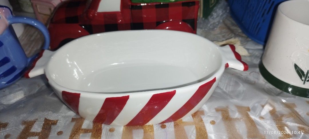 Red and White Striped Ceramic Serving Bowl with Handles (Category: Dinnerware & Cutlery) located in Manila. Submitted by silverwhale_cafa21 (Listing ID 1456779727, Image 3). Description: - Adorable ceramic serving bowl - Features a fun red and white stripe pattern - Includes convenient little handles on the sides - Ideal for serving snacks, dips, or small dishes - Measures approximately 9 inches in length - Great for parties, gatherings, or every