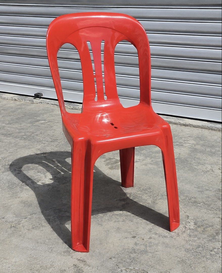 Red Plastic Stackable Chair (Category: Chairs) located in Shah Alam. Submitted by atinatirah1 (Listing ID 1456738244, Image 2). Description: - Red plastic chair - Stackable design - Durable and sturdy construction - Ideal for events or extra seating - Minor cosmetic scuffs from use - Pick up only.