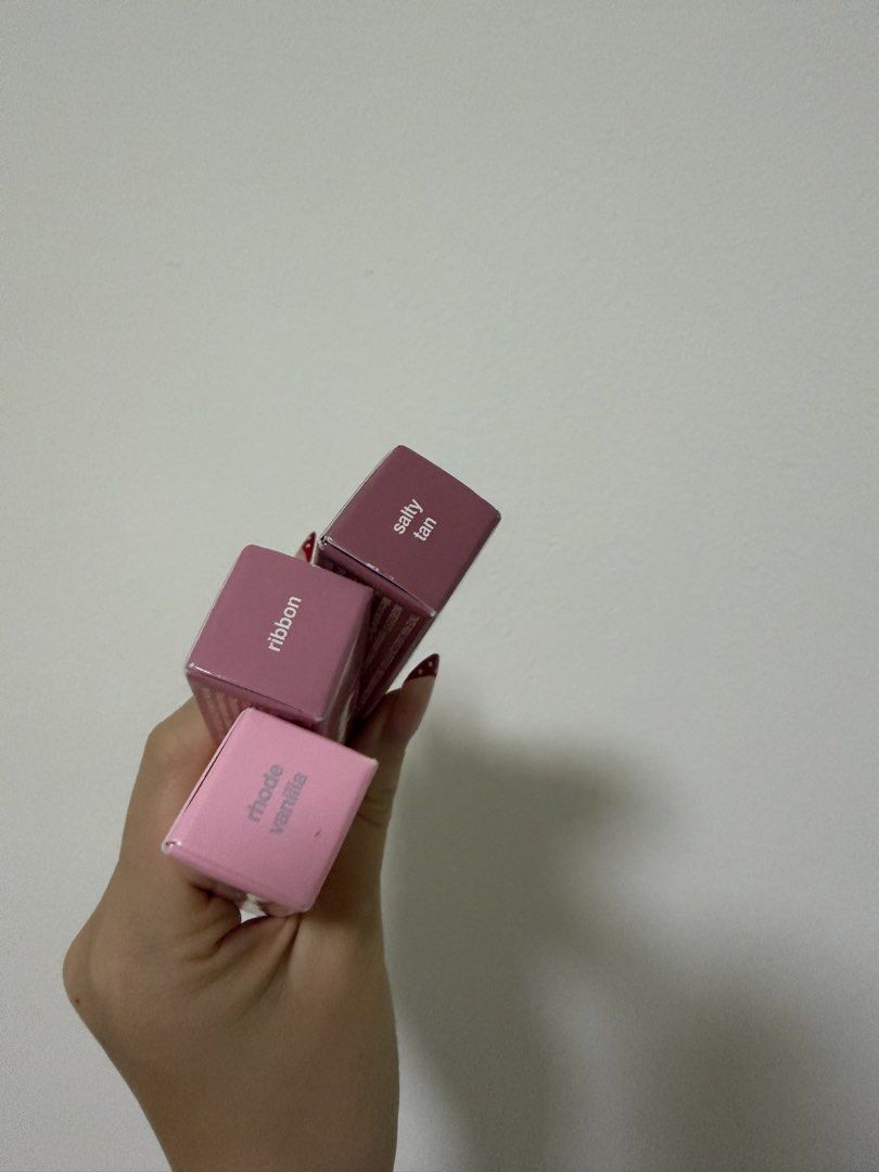 Rhode Instocks (Category: Makeup) located in Singapore. Submitted by dreamygifts (Listing ID 1456725975, Image 3). Description: rhode ribbon lip tint x1 rhode salty tan lip tint x1 rhode vanilla lip treatment x1 $36 each :) all brand new in box, can provide receipt proof.