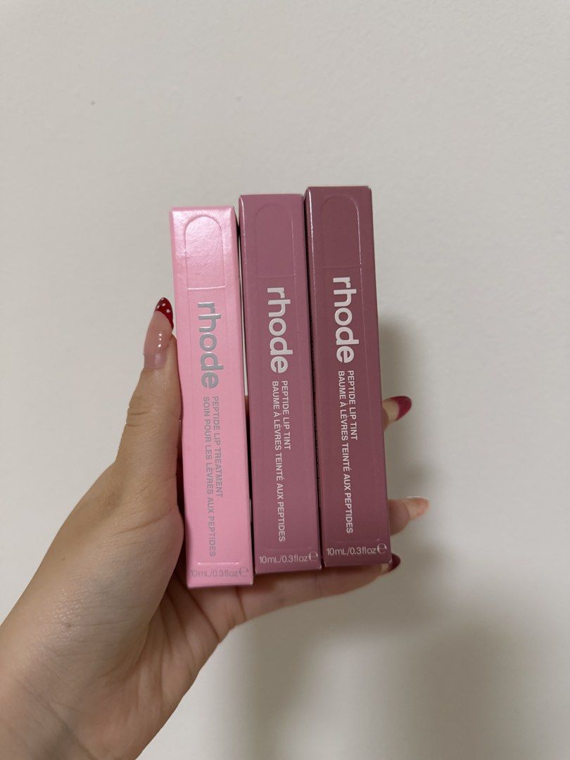 Rhode Instocks (Category: Makeup) located in Singapore. Submitted by dreamygifts (Listing ID 1456725975, Image 1). Description: rhode ribbon lip tint x1 rhode salty tan lip tint x1 rhode vanilla lip treatment x1 $36 each :) all brand new in box, can provide receipt proof.
